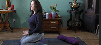 A person with long hair sitting